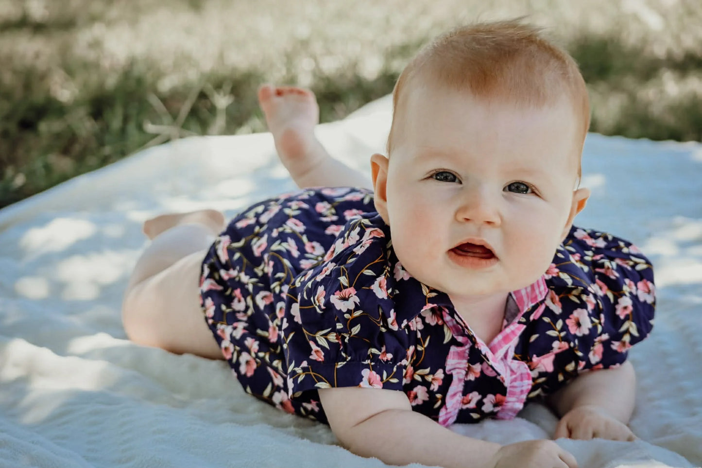 Little Windmill Clothing Co. "Harlo" Naavy Floral Short Sleeve Romper